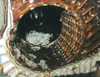 Issue 1: Impurities accumulate at inlet port hole